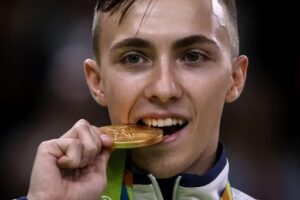 olimpijada sportisti griženje medalja